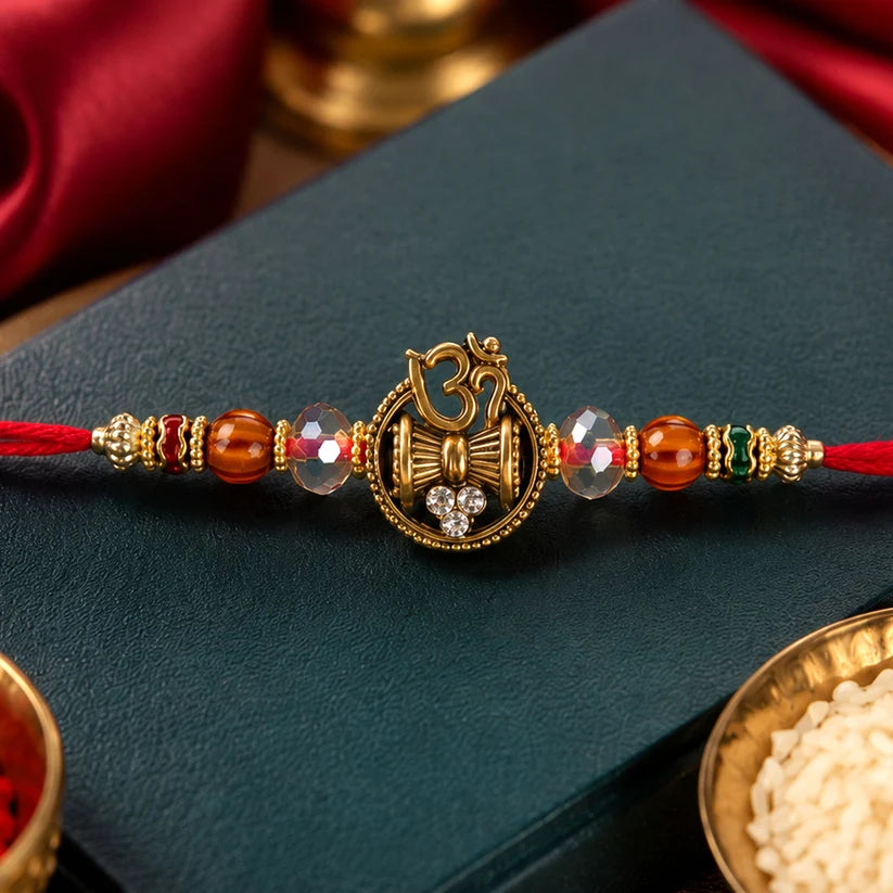 Devotional Rakhi Om Damru Trishul Design with Sparkling Stones
